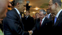 Barack Obama and Raúl Castro shake hands as they meet for the first time at the 2015 Summit of the Americas in Panama [Photo Credit: Reuters]